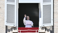 Pope Leo XIV waves to faithful during the Angelus prayer from the window of the Apostolic Palace overlooking St. Peter's Square, in the Vatican, on October 11, 2026. (Photo by Filippo MONTEFORTE / AFP)