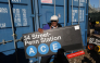 Film director Spike Lee holds a subway sign as people take home a piece of New York City's transportation system on October 9, 2026. Photos by Timothy A Clary / AFP
