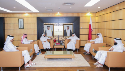 Officials from the two entities during a meeting in Doha