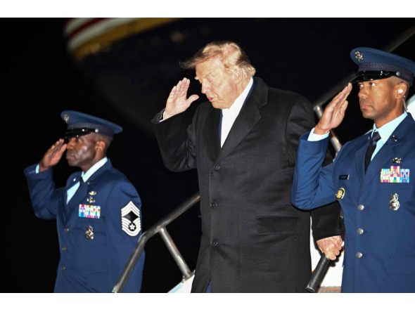 US President Donald Trump disembarks Air Force One upon arrival to Harry Reid International Airport in Las Vegas, Nevada, in the early hours of October 14, 2026. (Photo by Kent Nishimura / AFP)
