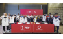 Representatives from the participating teams pose with their jerseys. 