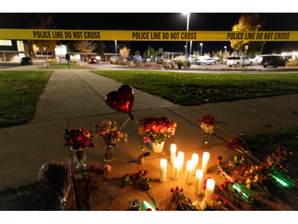 Candles and flowers are seen at a makeshift memorial outside the Silver Rail Elementary School following a shooting in Bend, Oregon, on October 15, 2026. Photo by Payton Bruni / AFP