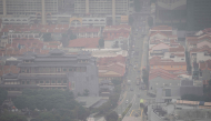 A general view of Chinatown in Singapore on October 16, 2026, as the country continues to be shrouded in haze caused by fires in Indonesia. (Photo by Yuichi Yamazaki / AFP)