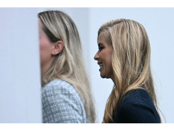 White House Press Secretary Katie Zacharia (R) is seen at the White House in Washington, DC, on October 16, 2026. (Photo by Jim WATSON / AFP)