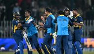 Sri Lanka's players celebrate after their victory in the one-day international (ODI) tri-series cricket match between England and Sri Lanka at the Rawalpindi Cricket Stadium in Rawalpindi on October 22, 2026. (Photo by FAROOQ NAEEM / AFP)