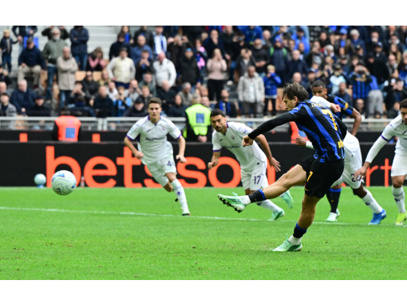 Inter Milan’s Piotr Zielinski shoots from the penalty spot to score a goal.