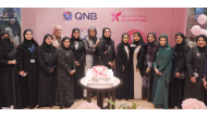 QNB Group and QCS officials at a breast cancer awareness event.
