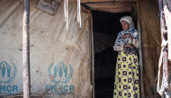 Representational photo showing a displaced Amhara woman stands at the entrance of her tent at the crowded Bakelo Camp for internally displaced people in Debre Berhan, on October 19, 2026. (Photo by Marco Simoncelli / AFP)