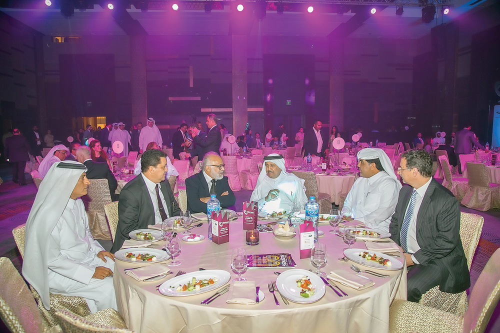 Sheikh Thani bin Abdullah Al Thani (third right), Chairman of SAK Holding Group, and Ali Mohammed Al Obaidli (second right), Group CEO of Ezdan Holding Group, at the Arabian Business Awards event in Doha.