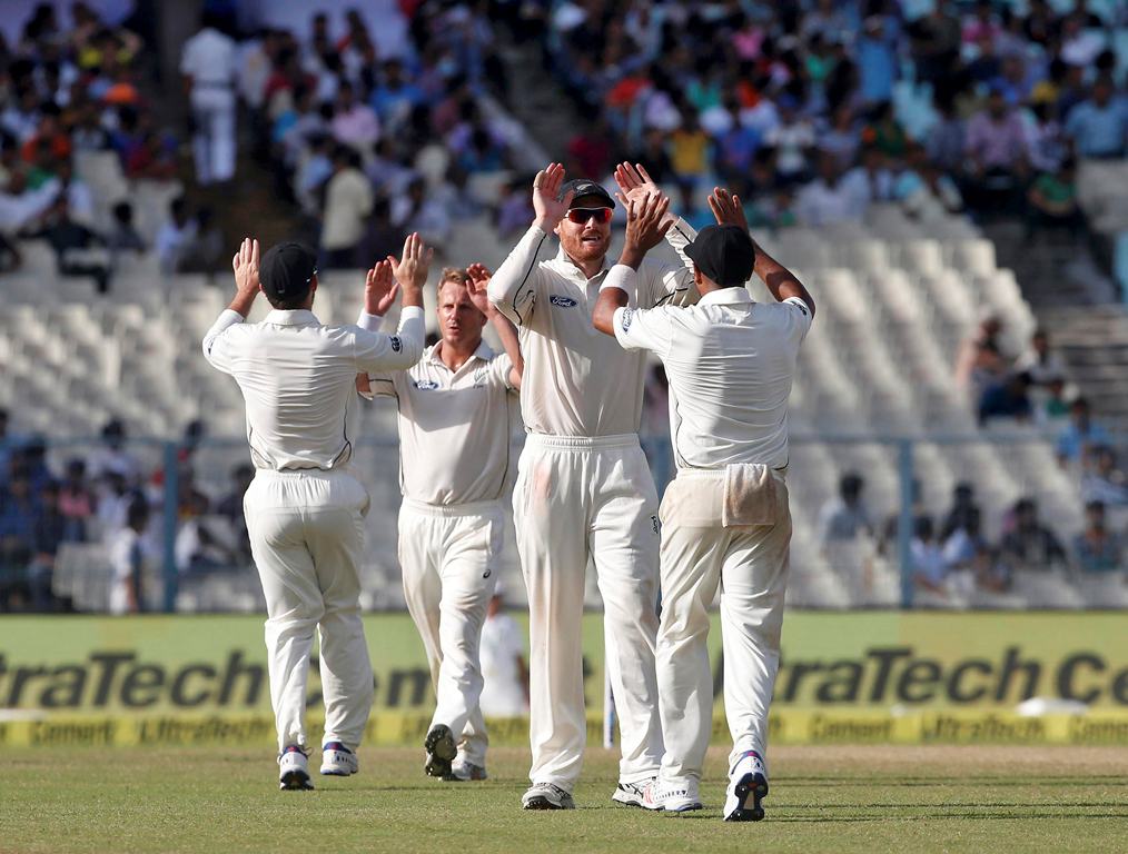 New Zealand's players celebrate the dismissal of India's Cheteshwar Pujara. (REUTERS/Rupak De Chowdhuri)