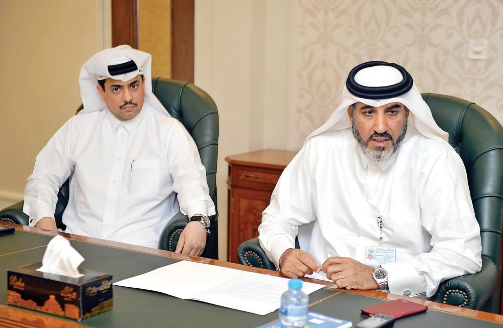 Abdul Hadi Ahen Ali Ahen (right) and QCB official Hassan Mohannadi addressing the media yesterday.Pic: Abdul Basit / The Peninsula