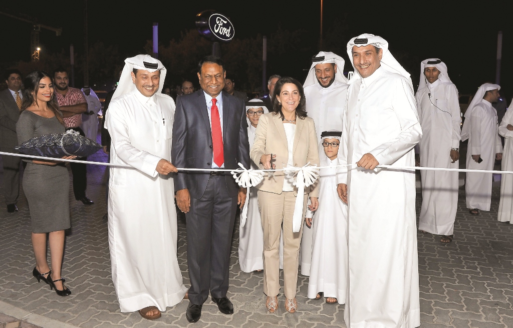 US Ambassador, Dana Shell Smith (centre) cutting a ceremonial ribbon to mark the opening of the Almana Motors Company’s New Ford and Lincoln Showroom at Airport Road in the presence of Bader Almana, (left)Managing Director of Almana Motors, Kalyana Sivagn