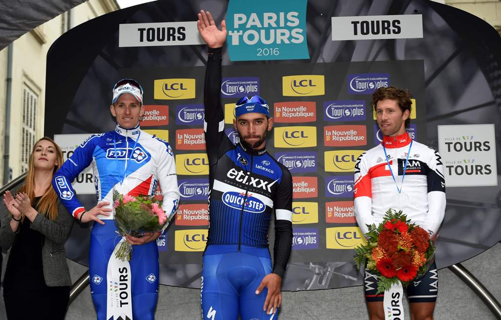 (From L to R) Second-placed French's cyclist Arnaud Demare of teaml FDJ, race winner Colombian cyclist Fernando Gaviri of team Etixx-Quick Step and third-placed Belgium's cyclist Jonas Van Genechten of team IAM CYCLING celebrate on the podium of the singl