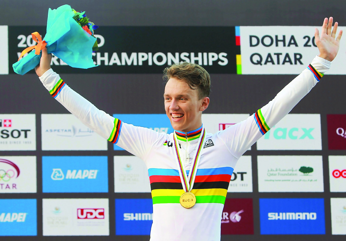 Denmark’s gold medallist Jakob Egholm celebrates on the podium at the end of the men’s juniors road race event of the UCI Road World Championships 2016 in Doha yesterday.