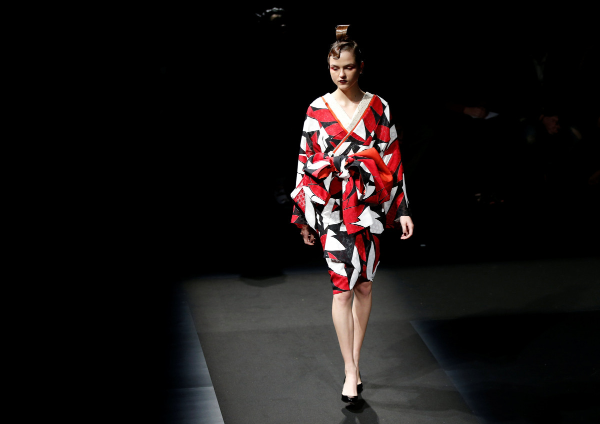 A model presents a creation by designer Yoshiki, leader of Japan's band 