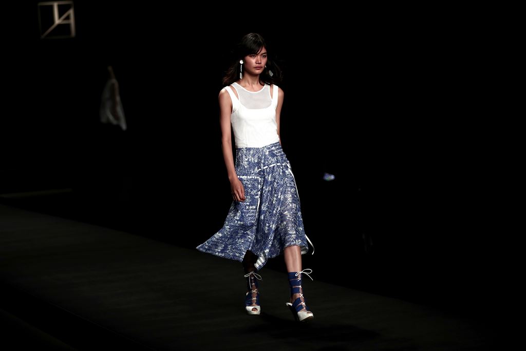 Japanese model Rina Fukushi presents a creation by Japanese designer Tae Ashida during the Tae Ashida 2017 Spring/Summer collection show in Tokyo. AFP / BEHROUZ MEHRI 
