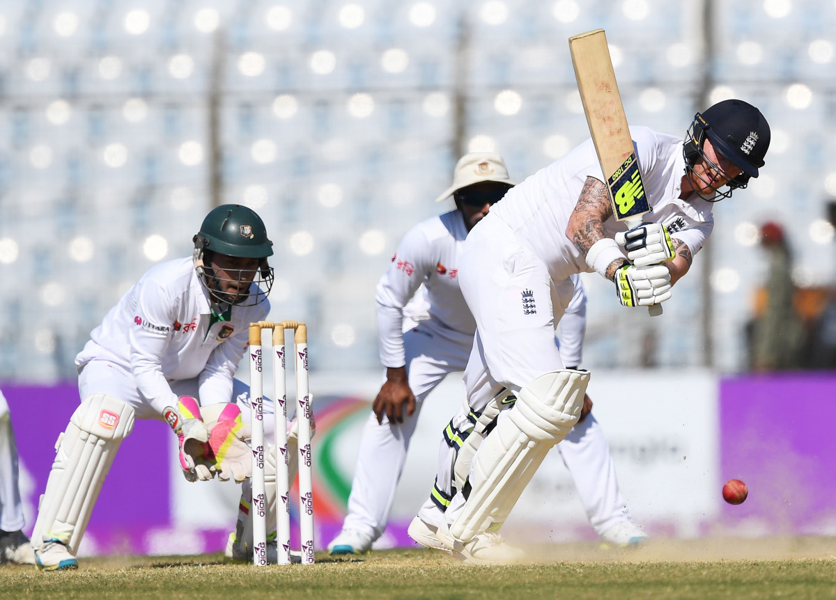 England's Ben Stokes plays a shot during the third day of the first Test match between Bangladesh and England at Zahur Ahmed Chowdhury Cricket Stadium in Chittagong on October 22, 2016 / AFP / Dibyangshu SARKAR
