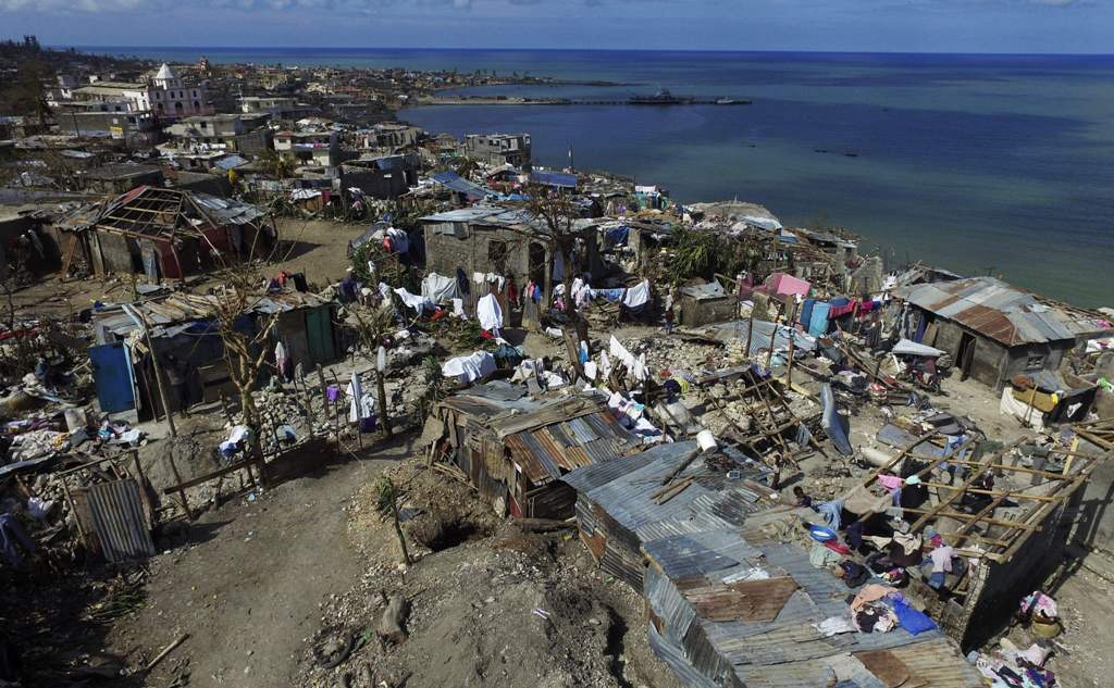 (FILES) This file photo taken on October 10, 2016 shows an aerial views of Jeremie, 188 km west of Port-au-Prince, following the passage of Hurricane Matthew. On a football field in the Haitian town of Jeremie, children gather to gape at a drone preparing