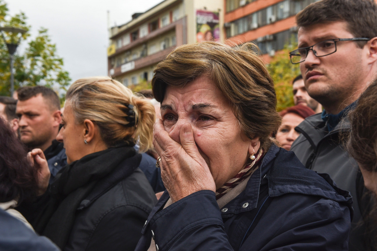 A Kosovar woman cries as she pays her respects beside the casket of activist and Vetevendosje opposition party leader Astrit Dehari after he 'suspiciously' died in prison, on November 8, 2016 in Pristina. Medical student Dehari died on November 6 at the p
