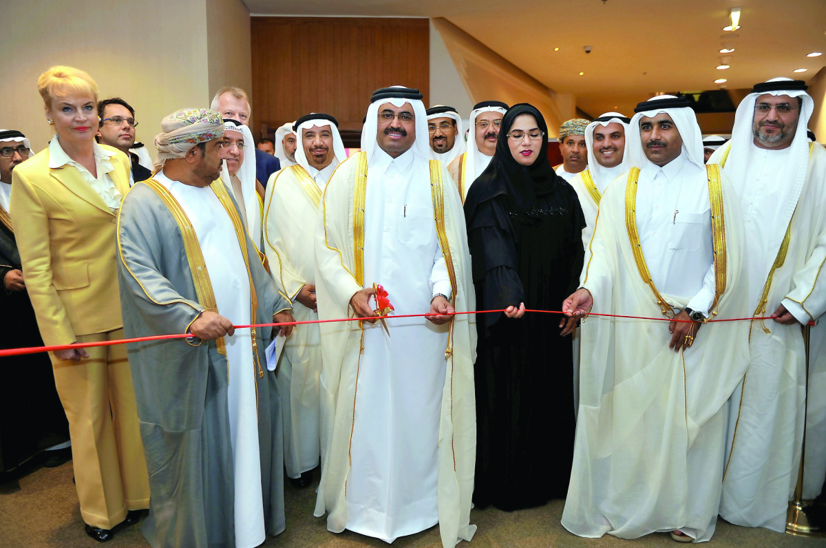 H E Dr Mohammed bin Saleh Al Sada, the Minister of Energy and Industry cutting a ribbon with  Essa bin Hilal Al-Kuwari, the President of Qatar General Electricity & Water Corporation and other officials to mark the opening of GCC Power 2016 forum and exhi