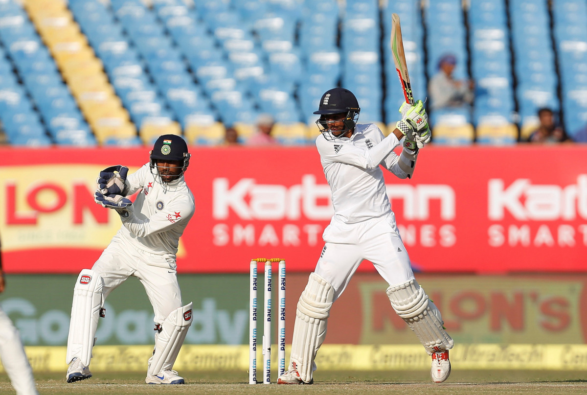England's Haseeb Hameed plays a shot as India's wicketkeeper Wriddhiman Saha looks on. (REUTERS/Amit Dave)
