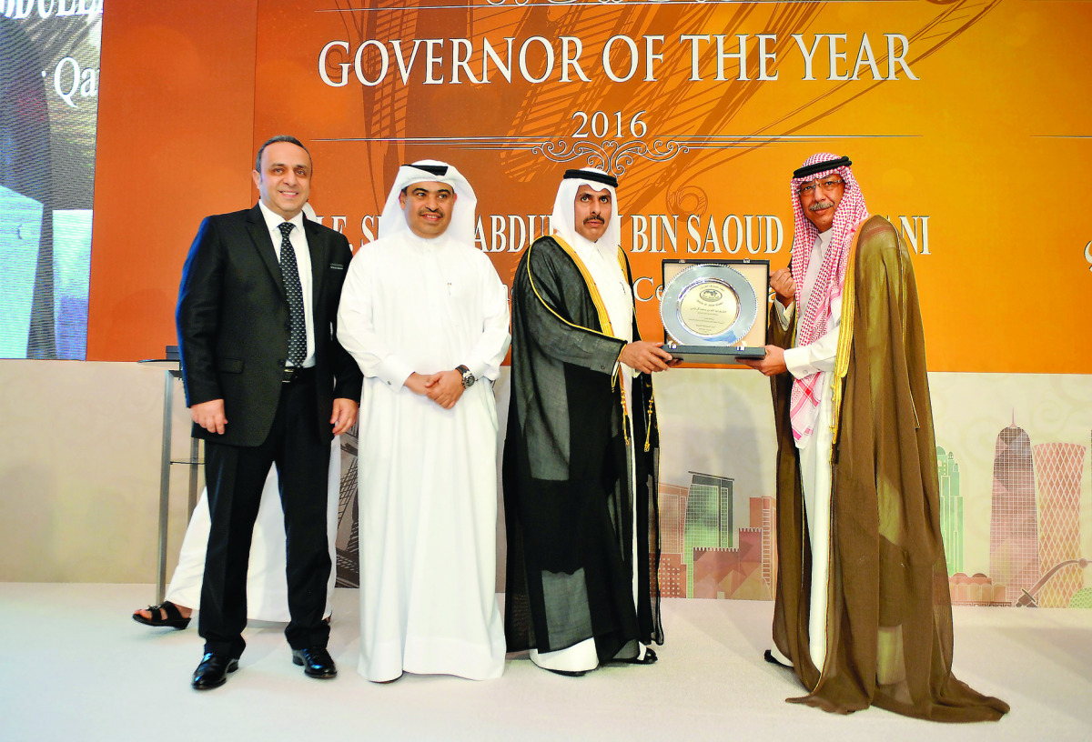 QCB Governor H E Sheikh Abdullah bin Saud Al Thani  (second right) receiving 'Governor of the Year 2016' award from Union of Arab banks (UAB) Chairman Sheikh Mmohammed Jarrah Al-Sabah, (right)  as UAB Board member Ali Ahmed Al Kuwari (second left) and Wis