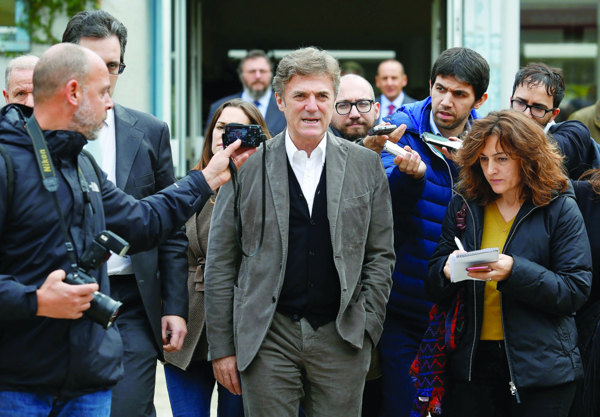 Telecom Italia Chief Executive Officer Flavio Cattaneo talks with reporters during a meeting in Rome, Italy, yesterday. Speculation that Telecom Italia may sell majority-owned TIM Participações, Brazil's second-largest wireless operator, has surfaced rece