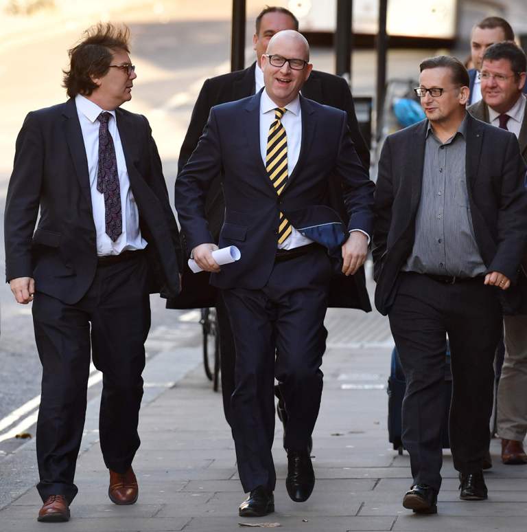 Newly-elected leader of the UK Independence Party, Paul Nuttall (C), arrives to attend the leadership announcement in central London on November 28, 2016. / AFP / BEN STANSALL