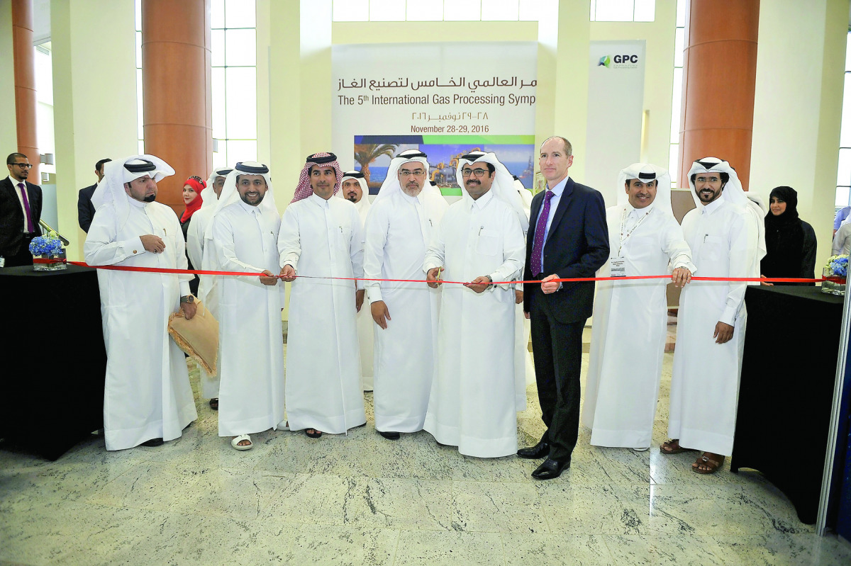H E Dr Mohammed bin Saleh Al Sada, Minister of Energy and Industry; and other officials cutting the ribbon marking the opening of  the Exhibiton of the 5th International Gas Processing Symposium, yesterday. Pic: Baher Amin/The Peninsula