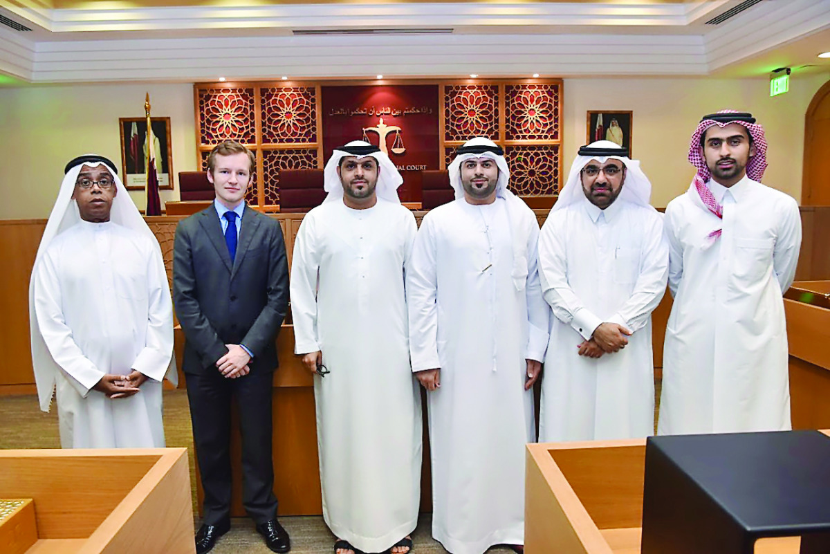 Judge Dr Hassan Al Sayed (second right) and the visiting UAE delegation with QICDRC judges  and officials in Doha recently. 