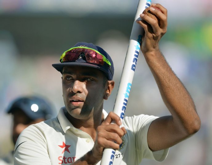 India's Ravichandran Ashwin celebrates during a victory lap after winning the fourth Test cricket match against England at the Wankhede stadium in Mumbai on December 12, 2016. (AFP / PUNlT PARANJPE)