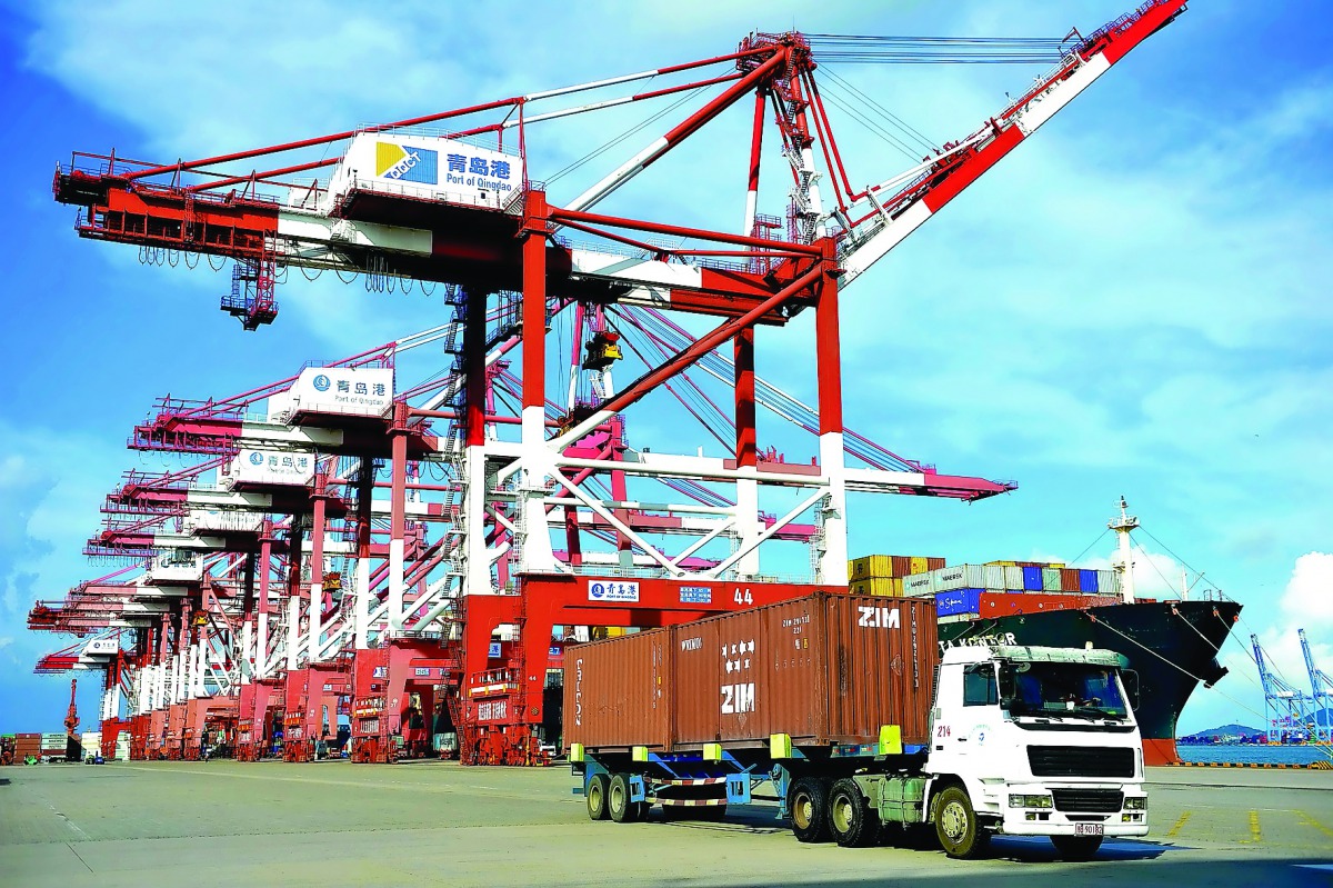 A truck transports containers at a port in Qingdao, eastern China’s Shandong province.