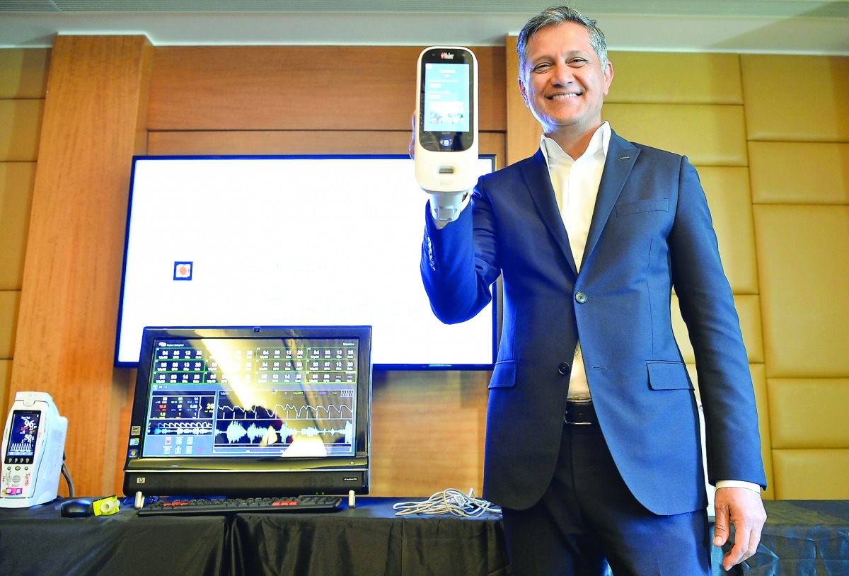 Founder and CEO of Masimo, Joe Kiani, displaying a medical device at a press conference in Bengaluru, India, yesterday. Masimo, the US-headquartered, global medical technology company,  will be tying up with Indian hospitals to bring non-invasive patient 