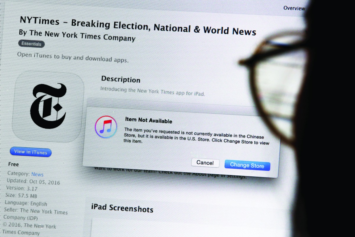 A person looking at a computer screen in Beijing showing an Apple iTunes store message saying that the New York Times app is not available in the Chinese store, yesterday.