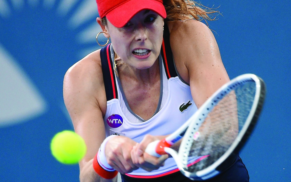 France's Alize Cornet returns the ball to Garbine Muguruza of Spain during their singles semi-final of the Brisbane International tennis tournament in Brisbane yesterday.