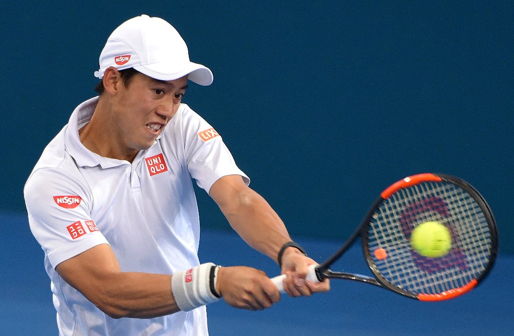 Japan’s Kei Nishikori hits a shot during his match against Switzerland’s Stan Wawrinka. REUTERS/Steve Holland
