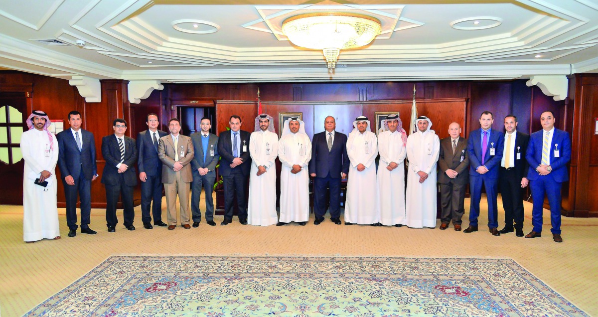 Abdulbasit Ahmed Al Shaibei CEO of QIIB, and top executives of the bank with Aala Ismail, Chairman of Banking Services for Major Companies,  at an event held to honour Aala to mark the end of his services.