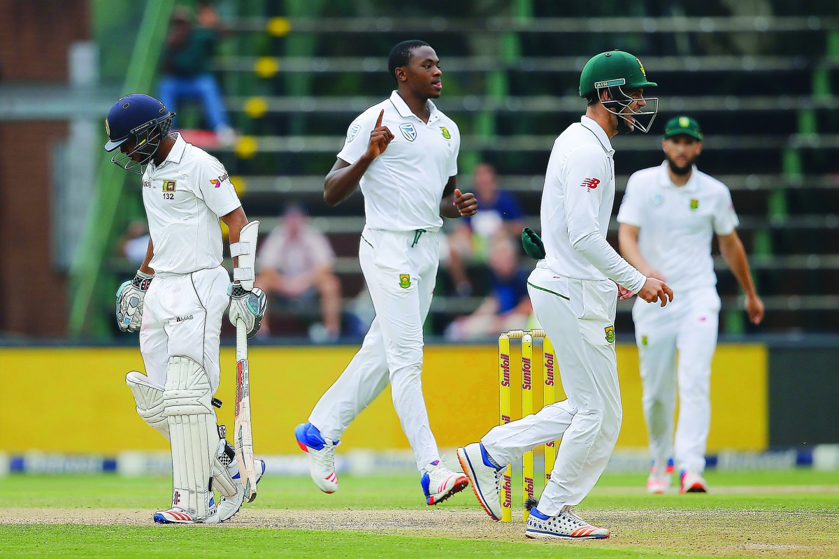 South African bowler Kagiso Rabada (centre) celebrates after bowling out Sri Lankan  batsman Kusal Mendis during the third Test at Wanderers Cricket Stadium in Johannesburg yesterday.