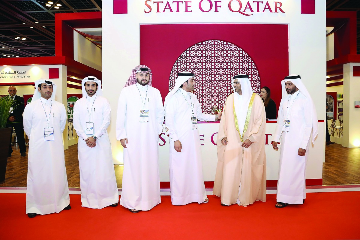 Officials of the participating companies at the Arabplast Exhibition. 