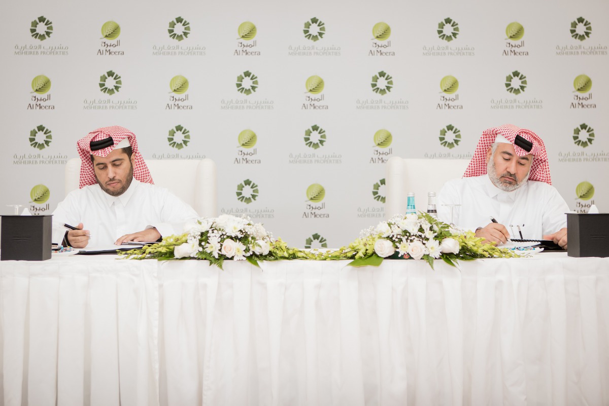 Sheikh Thani bin Thamer Al Thani and Abdulla Hassan Al Mehshadi signing the agreement.