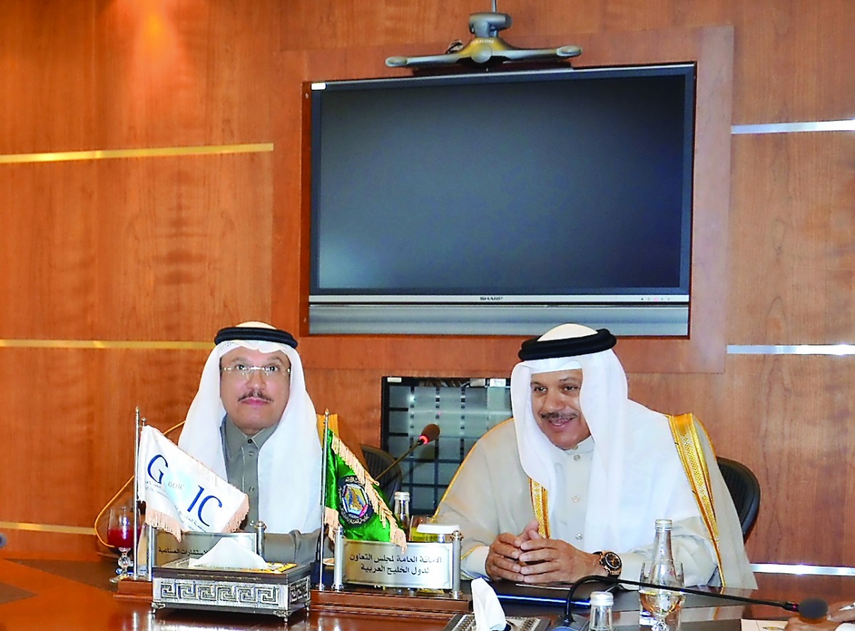 GCC Secretary-General Dr Abdullatif bin Rashid Al Zayani (right) with GOIC's Secretary-General Abdulaziz bin Hamad Al Ageel in Doha, yesterday. 