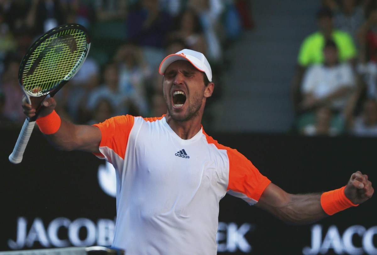 Germany's Mischa Zverev celebrates after winning his Men's singles fourth round match against Britain's Andy Murray. (REUTERS/Thomas Peter)