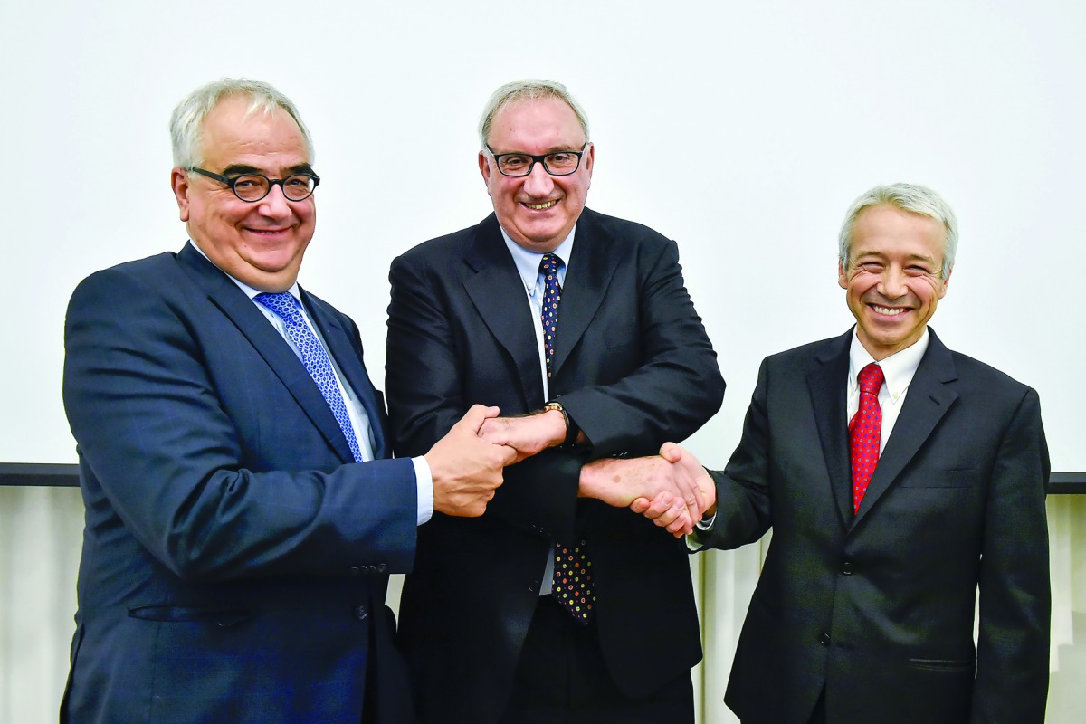 From left: Johnson & Johnson Chief Scientific Officer Paul Stoffels, Actelion CEO and co-founder Jean-Paul Clozel and Johnson & Johnson Executive Vice President Joaquin Duato pose during a press conference of the Swiss bio-pharmaceutical firm at their hea