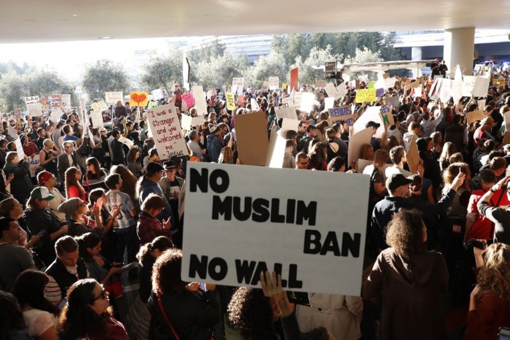 Demonstrators block traffic at the international arrival terminal as they protest against muslim immigration ban at San Francisco International Airport on January 28, 2017 in San Francisco, California. Stephen Lam/Getty Images/AFP