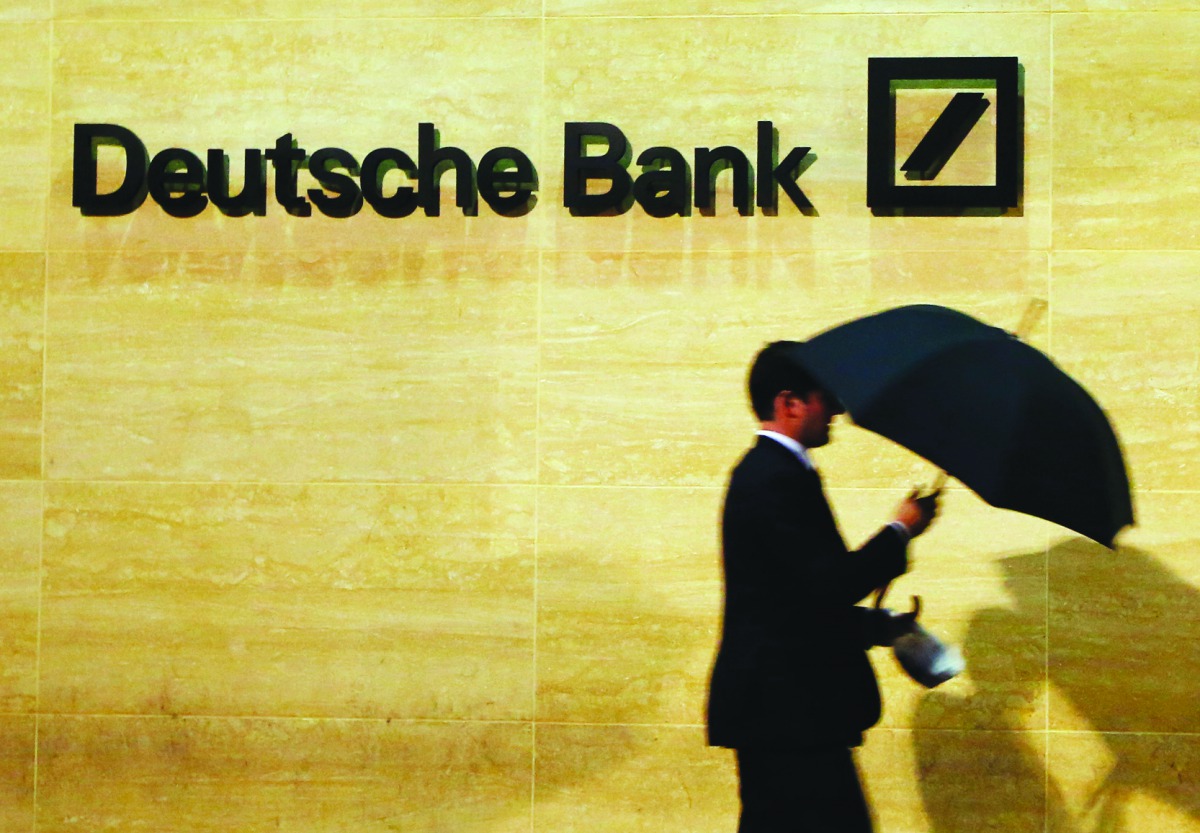 A man walks past Deutsche Bank offices in London.