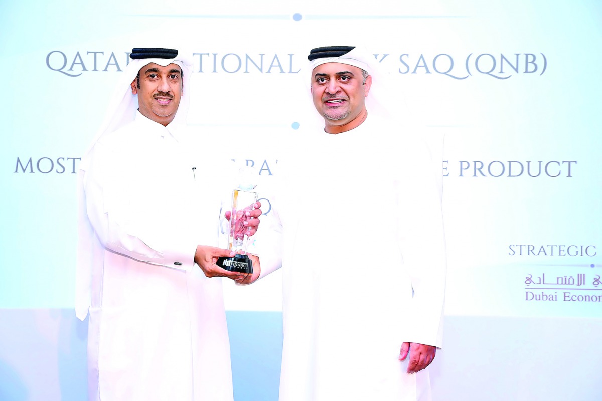 A QNB official receives the ‘Most Innovative Bancassurance Product Qatar 2016’ award, during a ceremony held by the International Finance Magazine (IFM), in Dubai.