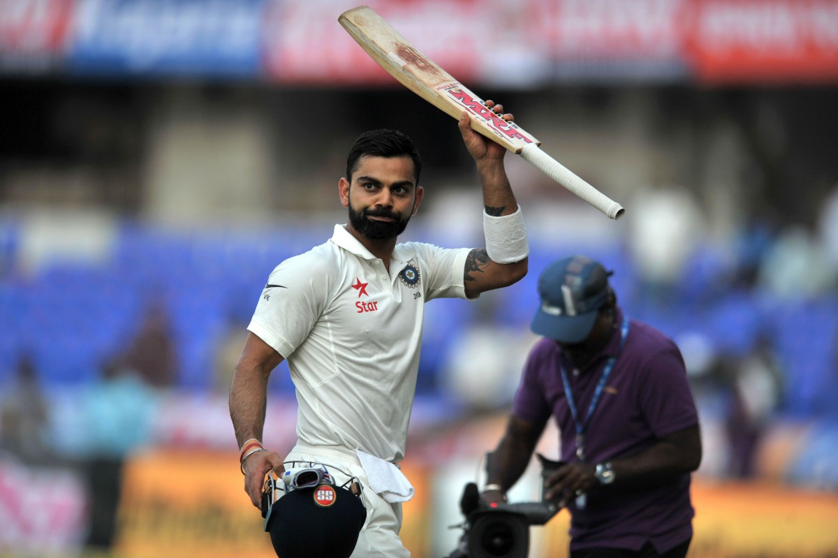 India's Virat Kohli gestures to the stands as he walks back to the pavilion at stumps on the first day of the Test cricket match between India and Bangladesh at The Rajiv Gandhi International Cricket Stadium in Hyderabad on February 9, 2017. (AFP / NOAH S