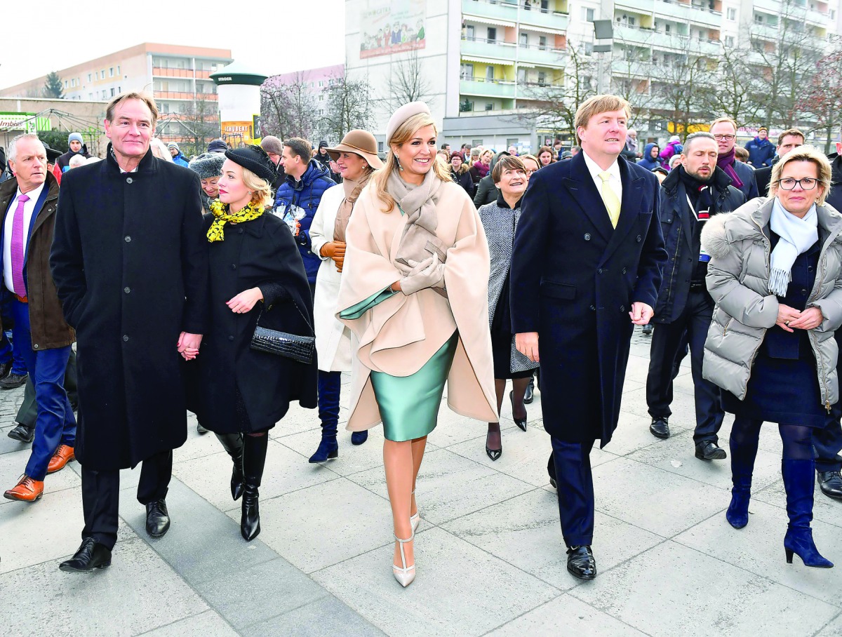 King Willem-Alexander (centre right) and Queen Maxima (centre left) of The Netherlands walk next to Leipzig's mayor Burkhard Jung (left) during a visit in Leipzig, eastern Germany, yesterday.