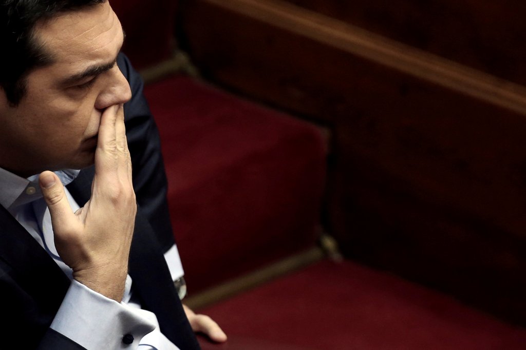 FILE PHOTO:Greek Prime Minister Alexis Tsipras looks on before answering a question on corruption, during the Prime Minister's Question Time at the parliament in Athens, Greece, February 10, 2017. REUTERS/Alkis Konstantinidis
