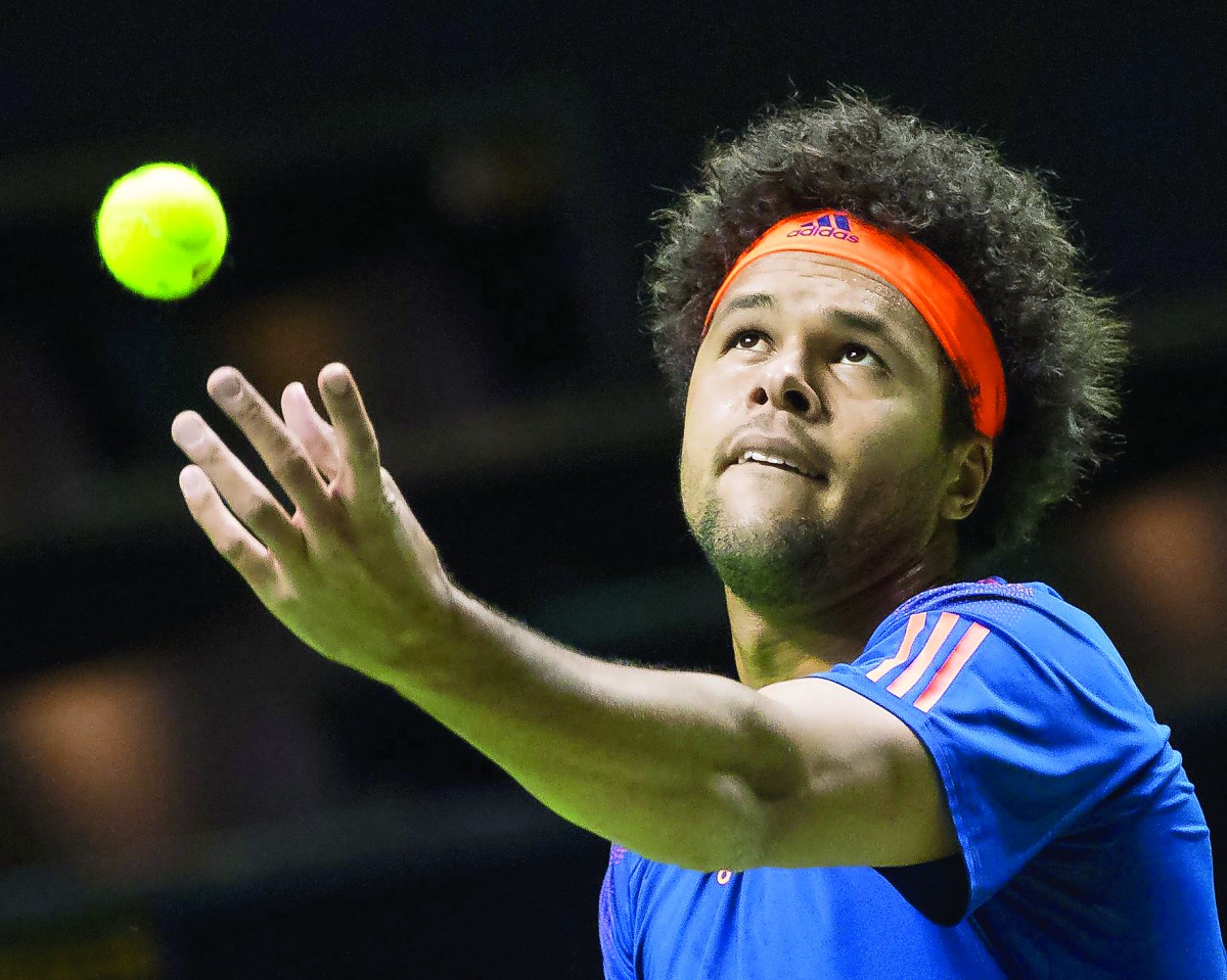 France's Jo-Wilfried Tsonga serves the ball to Greece's Stefanos Tsitsipas during his quarter-final match at the Rotterdam World Tennis Tournament in Rotterdam, yesterday.